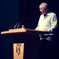 Steve Robert speaking at a Ball State University podium